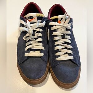 Nike suede sneaker navy with gum sole.